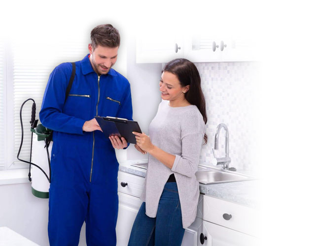 Pest control technician with customer